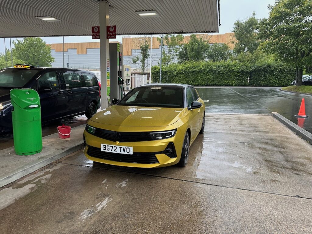 Gold Vauxhall Astra Plug-In Hybrid in petrol station