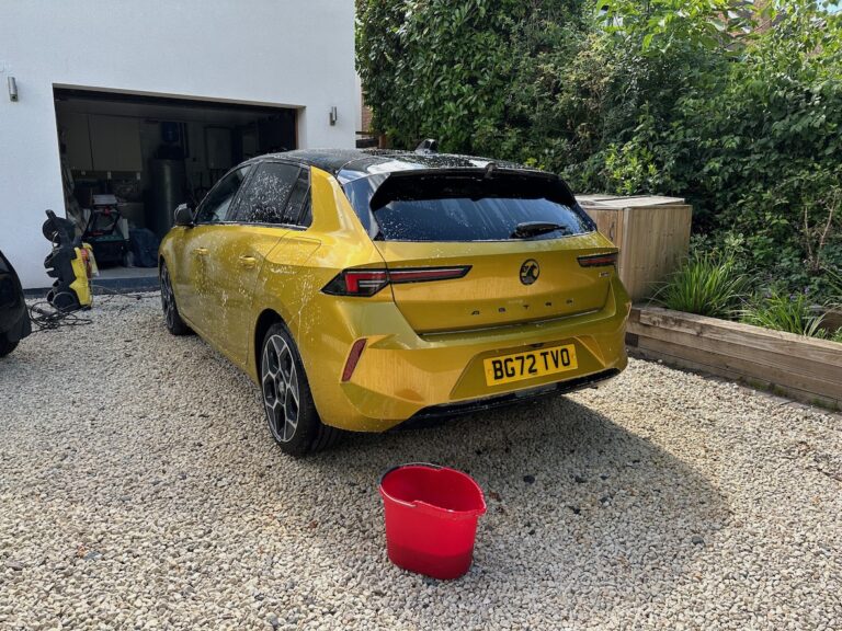 Gold-coloured Vauxhall Astra PHEV being washed