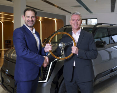 UK Car of the Year Co_Chariman John Challen hands over award to Kia boss Paul Philpott for the EV9