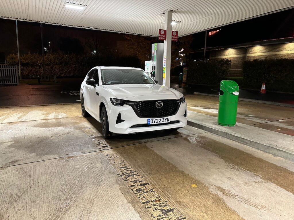 White Mazda CX60 PHEV at petrol pump