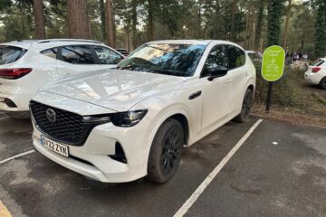 White Mazda CX60 PHEV charging on public charger