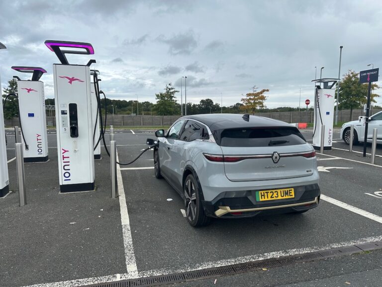 Grey Renault Megane EV charging at Ionity