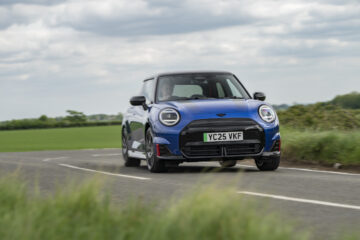 Blue Mini Cooper JCW Electric cornering