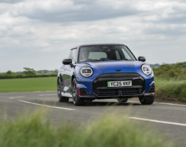 Blue Mini Cooper JCW Electric cornering