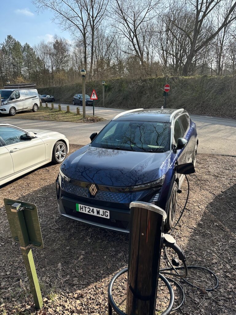 Blue Renault Scenic E-tech charging at Podpoint charger at Centreparcs