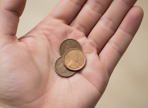 3 one pence pieces in palm of hand