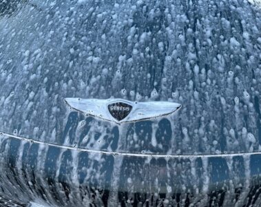 Genesis Gv60 badge in car wash