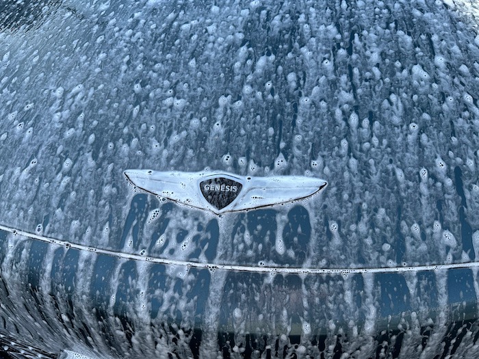 Genesis Gv60 badge in car wash