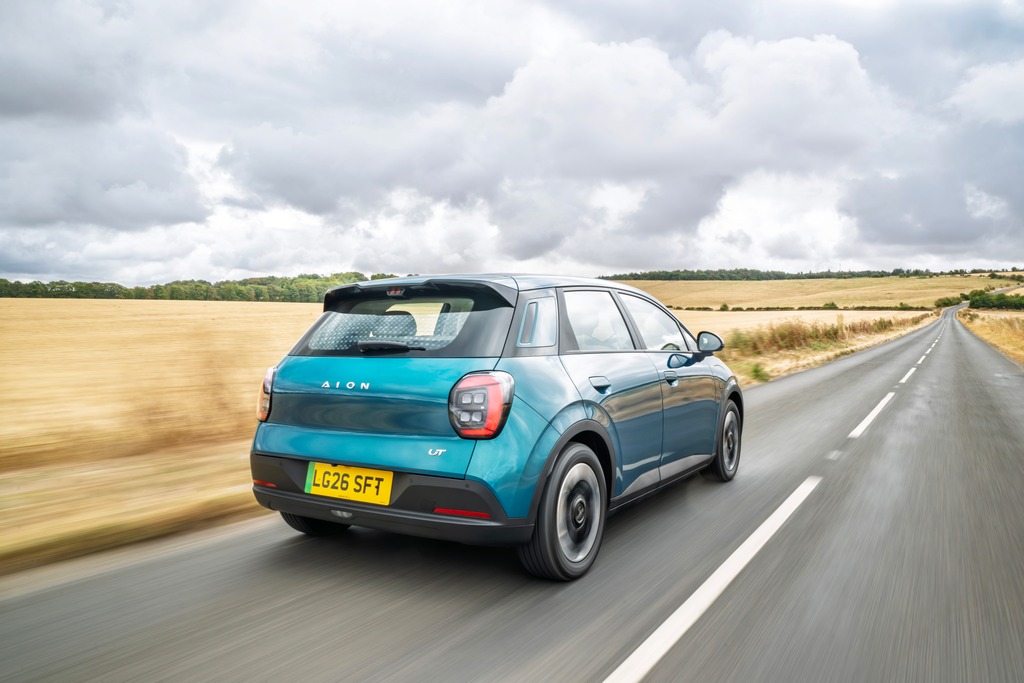 Blue Aion UT driving on the road rear view